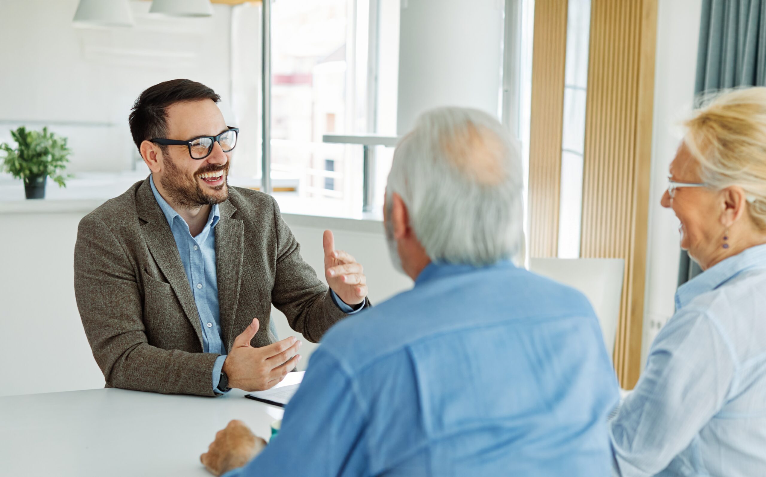 A business professional having a positive meeting with his clients.
