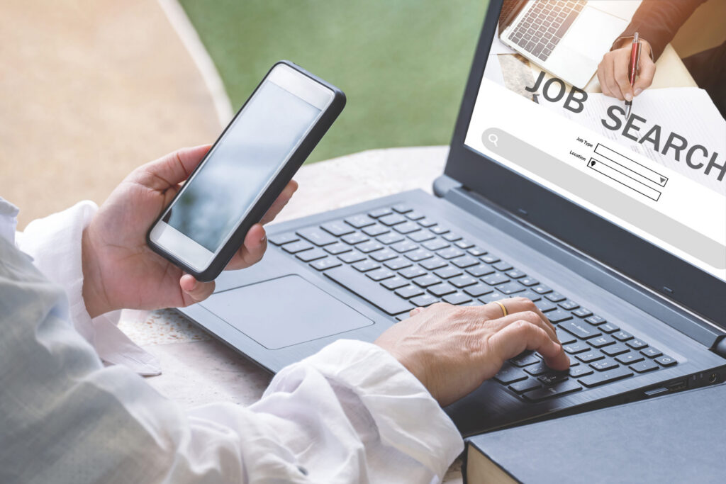 A job seeker about to look for vacancies online using her laptop.