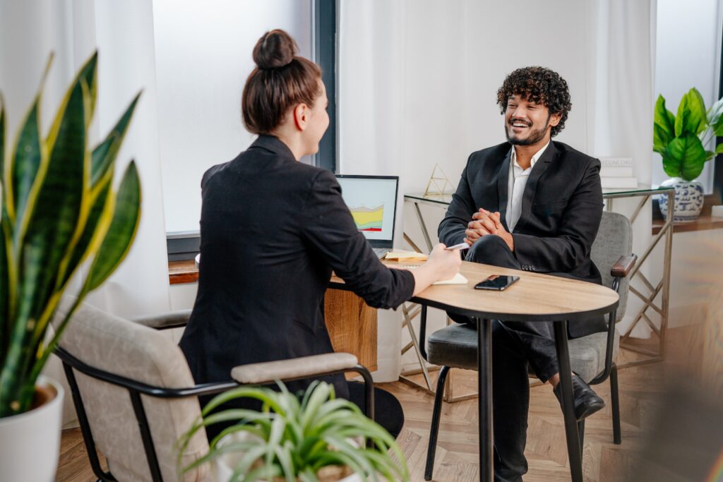 A young adult being interviewed in a cozy office setting